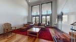 Newly renovated modern living area with a private balcony, mountain views, and a wood burning fireplace